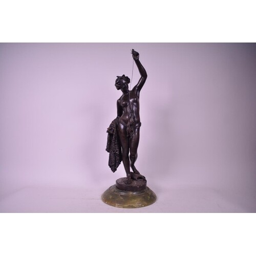An Italian style bronzed iron figure after the antique, on a...