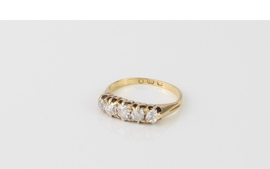 An antique 18ct yellow gold and cushion cut diamond five sto...