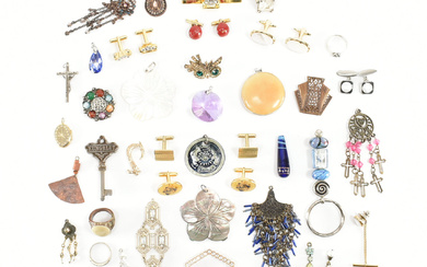 An assorted collection of costume jewellery. The lot to include; gold & silver tone metal, cufflinks, necklace pendants, rings, tie clip, bead, keyring, hair clip, scarf clip, belt buckle, mother of pearl shell, flowers, abalone, white stones, ceramic...