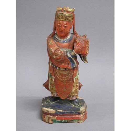 An early 19c Chinese carved wood polychrome decorated figure...