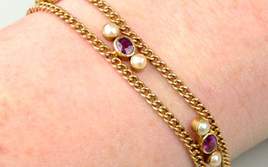 An early 20th century gold two-row curb-link bracelet, with ruby and split pearl trefoil spacers.