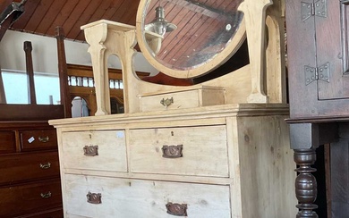 An early 20th century pine mirror back dressing table with...