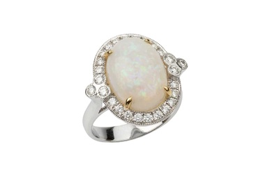 An opal and diamond dress ring, the oval cabochon opal...