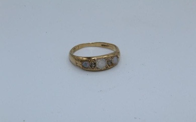 An opal and diamond set 18ct gold half hoop ring....