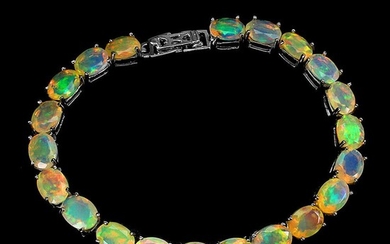 NOT SOLD. An opal bracelet set with numerous cabochon opals, mounted in rhodium plated sterling silver. L. 18 cm. – Bruun Rasmussen Auctioneers of Fine Art