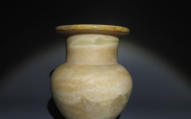 Ancient Egyptian Alabaster Jar. New Kingdom, 1550 - 1070 BC. 10,2 cm H. Nice patina.