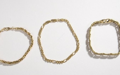 BRACELETS (three) in 18k yellow gold. Weight: 33...
