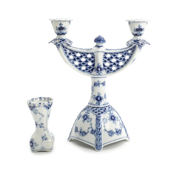 SOLD. "Blue Fluted Full Lace". Royal Copenhagen porcelain two-armed candlestick and vase. H. 25 and 10 cm. (2) – Bruun Rasmussen Auctioneers of Fine Art
