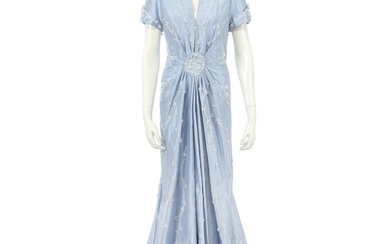 Bruce Oldfield Haute Couture light blue dress made of silk with hand embroided white pearls and crystals and a low v neckline.