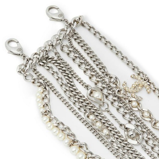 Chanel - a multi-chain and imitation pearl bracelet.