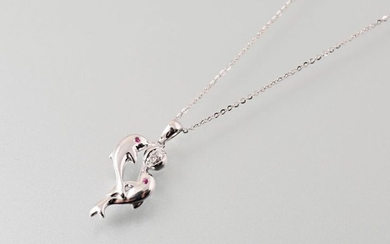 Dolphins" pendant and its 750 thousandths white gold...