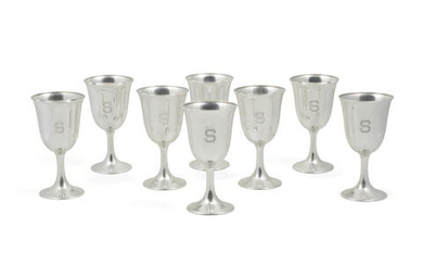 EIGHT AMERICAN STERLING SILVER CUPS AND A PITCHER