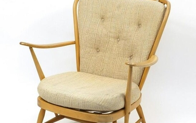 Ercol light elm Windsor stick back arm chair, 83cm high