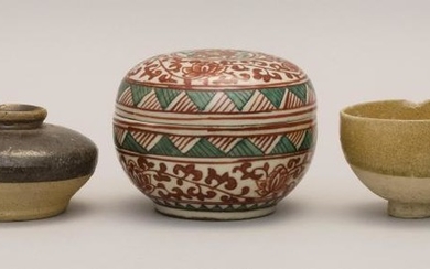 FIVE PIECES OF ASIAN CERAMICS A Ming celadon stoneware jarlet, a celadon stoneware footed cup, a Liao stoneware jarlet, a Sawankhalo...