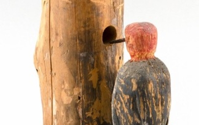 FOLK ART CARVING OF A RED-HEADED WOODPECKER ON A TREE BRANCH Height 8.75".