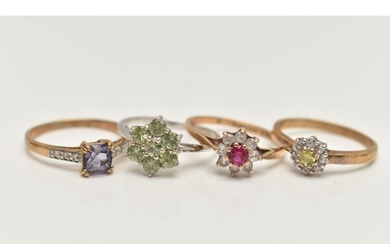 FOUR GEM SET RINGS, the first a yellow gold cluster ring set...