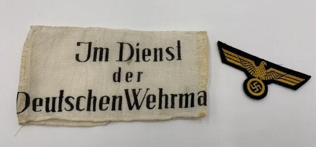 GERMAN WWII ARMBAND AND INSIGNIA