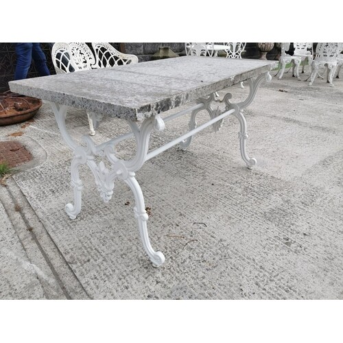Garden table with cast iron base and marble top in the Itali...