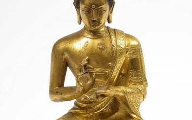 Gilt bronze "Buddha sitting on a lotus flower" with traces of polychromy. Sino-Tibetan work. Period: 18th century. (Without its copper base and a damaged hand). H.: +/-15,3cm.
