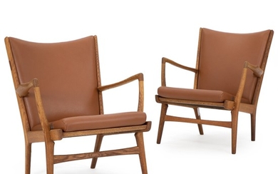Hans J. Wegner: “AP 16”. A pair of easy chairs with oak frame. Loose seat cusion and back upholstered with brown leather. (2)