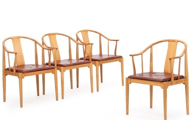 Hans J. Wegner: “China Chair”. A set of four armchairs with cherry wood frame. Cushions upholstered with reddish brown leather. (4)