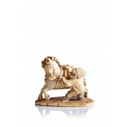 Ivory netsuke of a monkey entertainer dressed as a court servant restraining a horse, signed Japan, Meiji period (1868-1912) ...