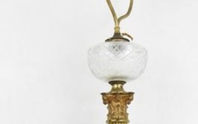 LARGE LAMP in gilded metal, the shaft forming...