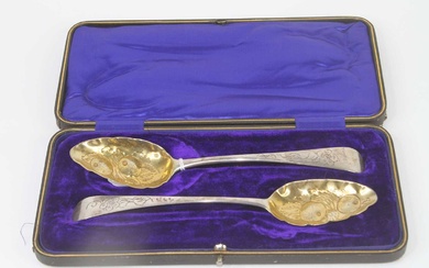 Lot details A pair of George III silver berry spoons,...