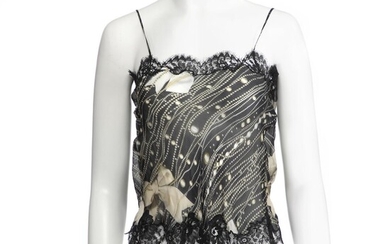 SOLD. Moschino: A black, green and white silk top with thin straps, lace and ribbon on the front. – Bruun Rasmussen Auctioneers of Fine Art