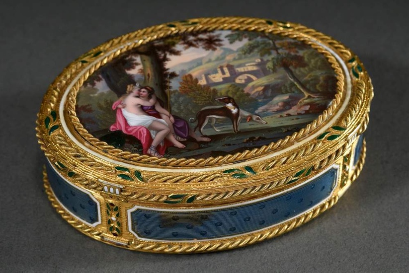 Oval gold tabatiere with fine enamel painting "Diana and female companion with dogs in wide landscape" in gold cord framing with green enamelled leaves and white band, rim and base with guilloché enamel in bleu mourant between column pilasters with...