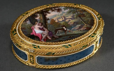 Oval gold tabatiere with fine enamel painting "Diana and female companion with dogs in wide landscape" in gold cord framing with green enamelled leaves and white band, rim and base with guilloché enamel in bleu mourant between column pilasters with...