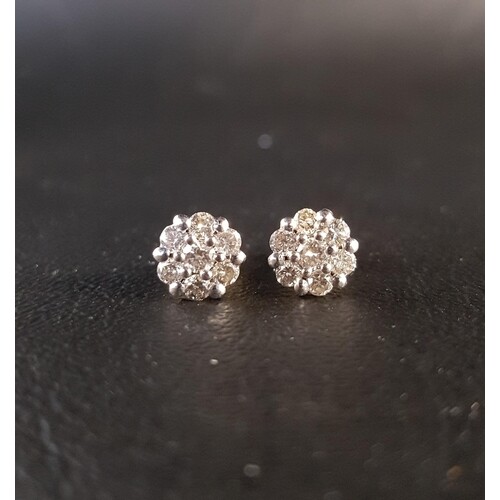 PRETTY PAIR OF DIAMOND CLUSTER EARRINGS each earring with a ...