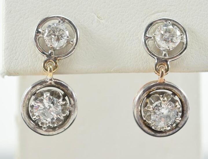 Pair of 14kt gold diamond stud drop earrings. White and