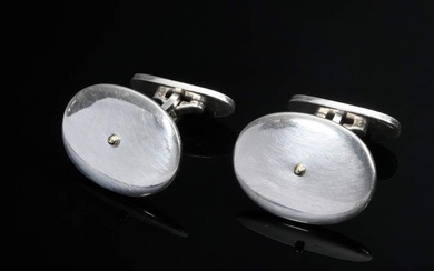 Pair of Georg Jensen silver 925 cufflinks, smooth surface with small button in the middle, original box, 18,2g, 22x16