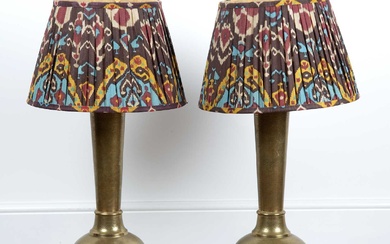 Pair of Persian brass converted lamps previously vases,with engraved foliat...