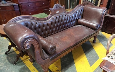 Regency Mahogany Double Ended Settee, with leaf scroll top, brown buttoned leather & bolster cushions, carved lyre fascia & turned r...
