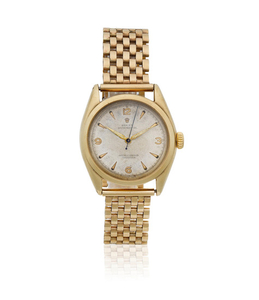 Rolex. A 9K gold automatic bracelet watch