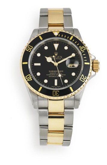 Rolex: A wristwatch of 18k gold and steel. Model Submariner,...