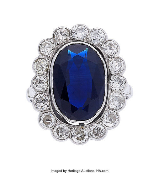 Sapphire, Diamond, Platinum Ring The ring features an oval-shaped...