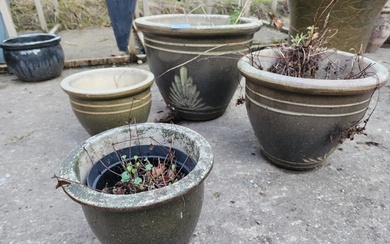 Set of four graduated exterior plant pots largest largest is...