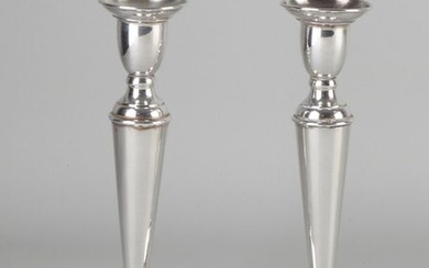 Set silver candlesticks, 925/000, on a round base decorated with a filet edge. Importer's mark: Rikkoert Schoonhoven. 9x18cm. In good condition