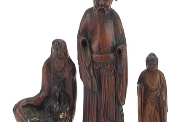 Three Chinese wood carvings including one of an elder and on...