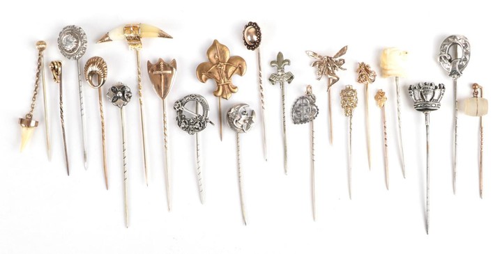 Twenty-One Stick Pins; including one with a tooth suspended, cased,...