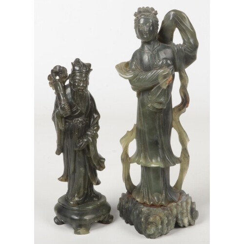 Two Chinese nephrite figural carvings. One formed as Guanyin...