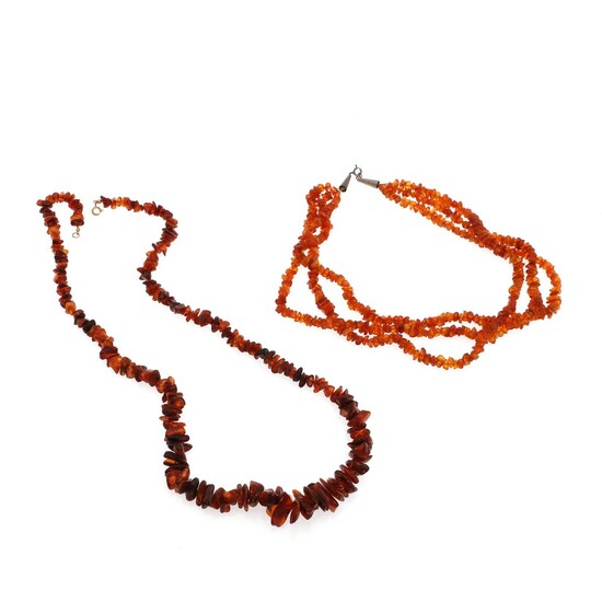 SOLD. Two amber necklaces comprising a three-strand and one-strand necklace each set with numerous amber pieces. L. 50 and 75 cm. (2) – Bruun Rasmussen Auctioneers of Fine Art