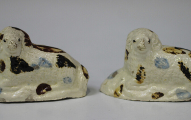 Two creamware pottery rams, late 18th/early 19th century, possibly Yorkshire, modelled recumbent wit
