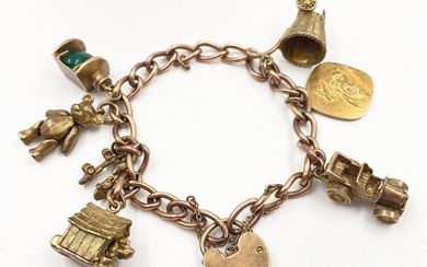 Un bracelet à breloques vintage en or jaune 9 carats. 20cm. 49g