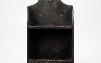 Small Black-painted Wall Shelf, 19th century, with squared hanger above two shelves joining shaped sides and squared drop below, ht. 23