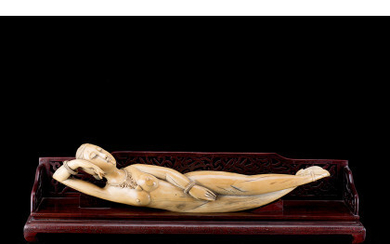 A large ivory model of a doctor's lady, wood base (defects) China, early 20th century (l. 63 cm.)