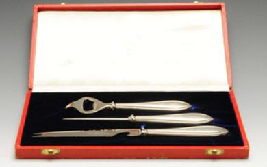 An American silver-handled three piece drinks set in Cartier case.